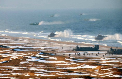  A picture released by North Korea's official Korean Central News Agency (KCNA) on March 26, 2013 appears to show evidence of digital manipulation, specifically the cloning of at least two hovercraft, to make it appear as if more vehicles were involved in a recent military exercise. The original caption: This picture released by North Korea's official Korean Central News Agency on March 26, 2013 and taken on March 25, 2013 shows the landing and anti-landing drills of KPA Large Combined Units 324 and 287 and KPA Navy Combined Unit 597 at an undisclosed location on North Korea's east coast. (KCNA Via KNS/AFP/Getty Images)