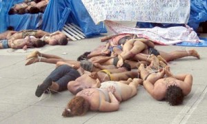 In the middle of afternoon rush hour, a van-load of 35 bodies was dumped on a highway underpass in full view of customers at a high-end shopping mall and cinema complex as well as passing commuters. Carolina was one who happened to drive right past on the way to her tutoring job.