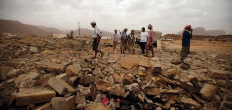 Tribesmen stand on the rubble of a building destroyed by a U.S. drone strike that targeted suspected al-Qaeda militants in the southeastern Yemeni provence of Shabwa on February 3, 2013. (Khaled Abdullah/Reuters/Corbis) 